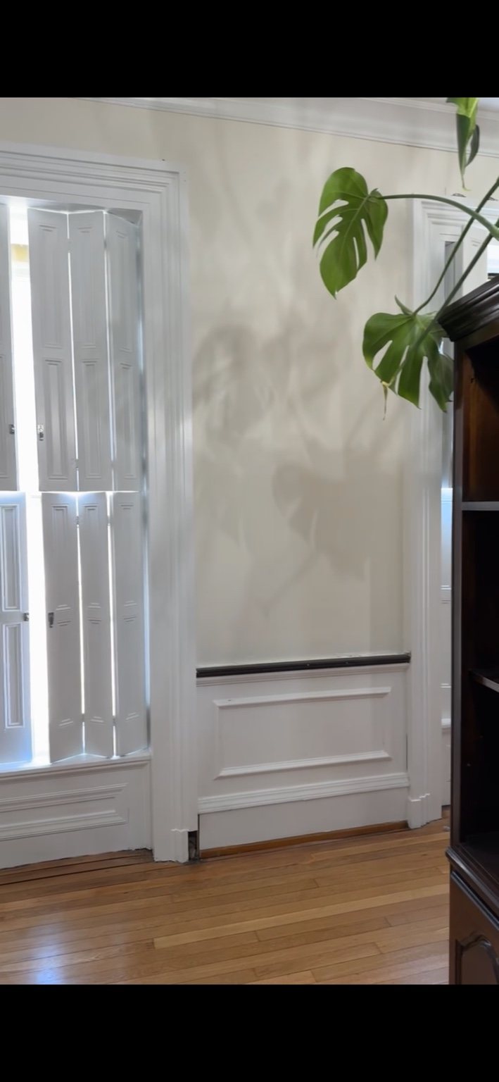 Historic interior with white trim and wall panels